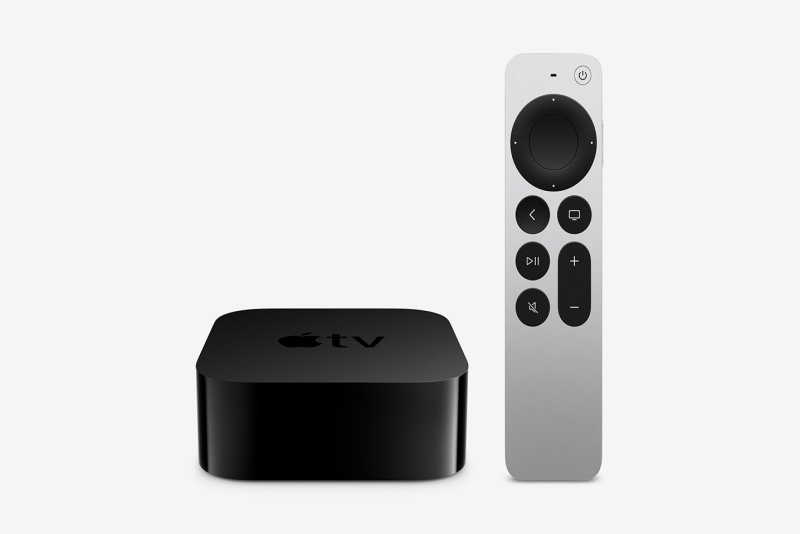 Apple TV console in black color and remote in grey