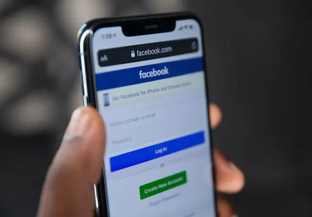 Phone with Facebook open on the screen